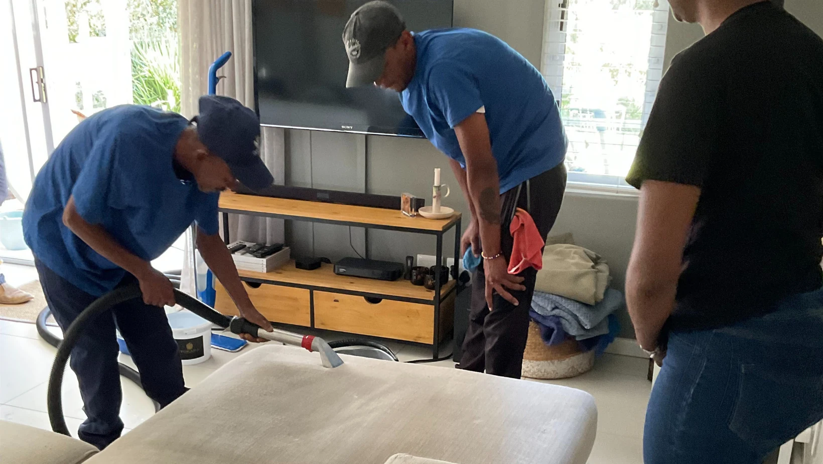 Cleaning team working with equipment at a property